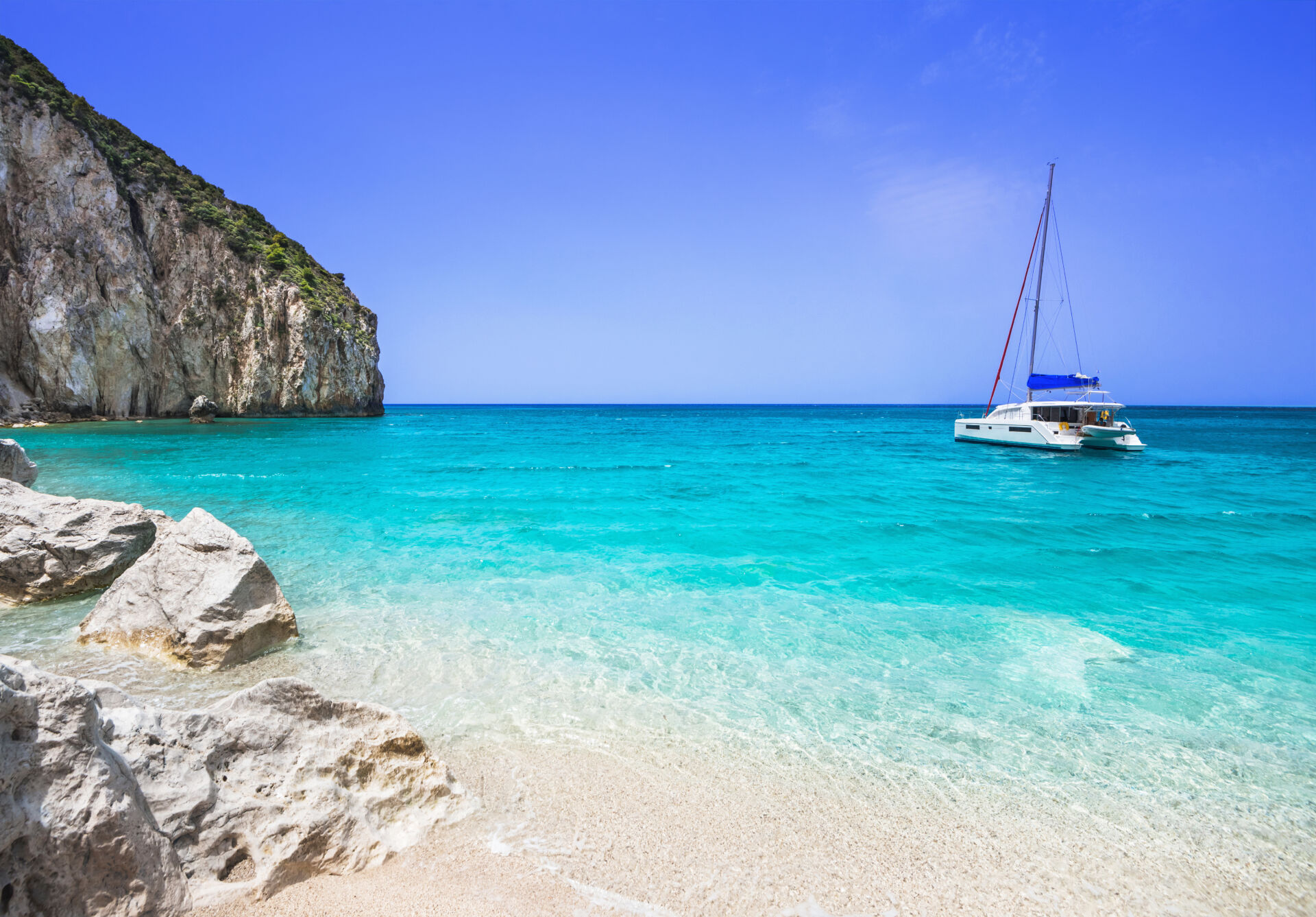 Beautiful lagoon with sailing boat and beach, Lefkada island, Greece